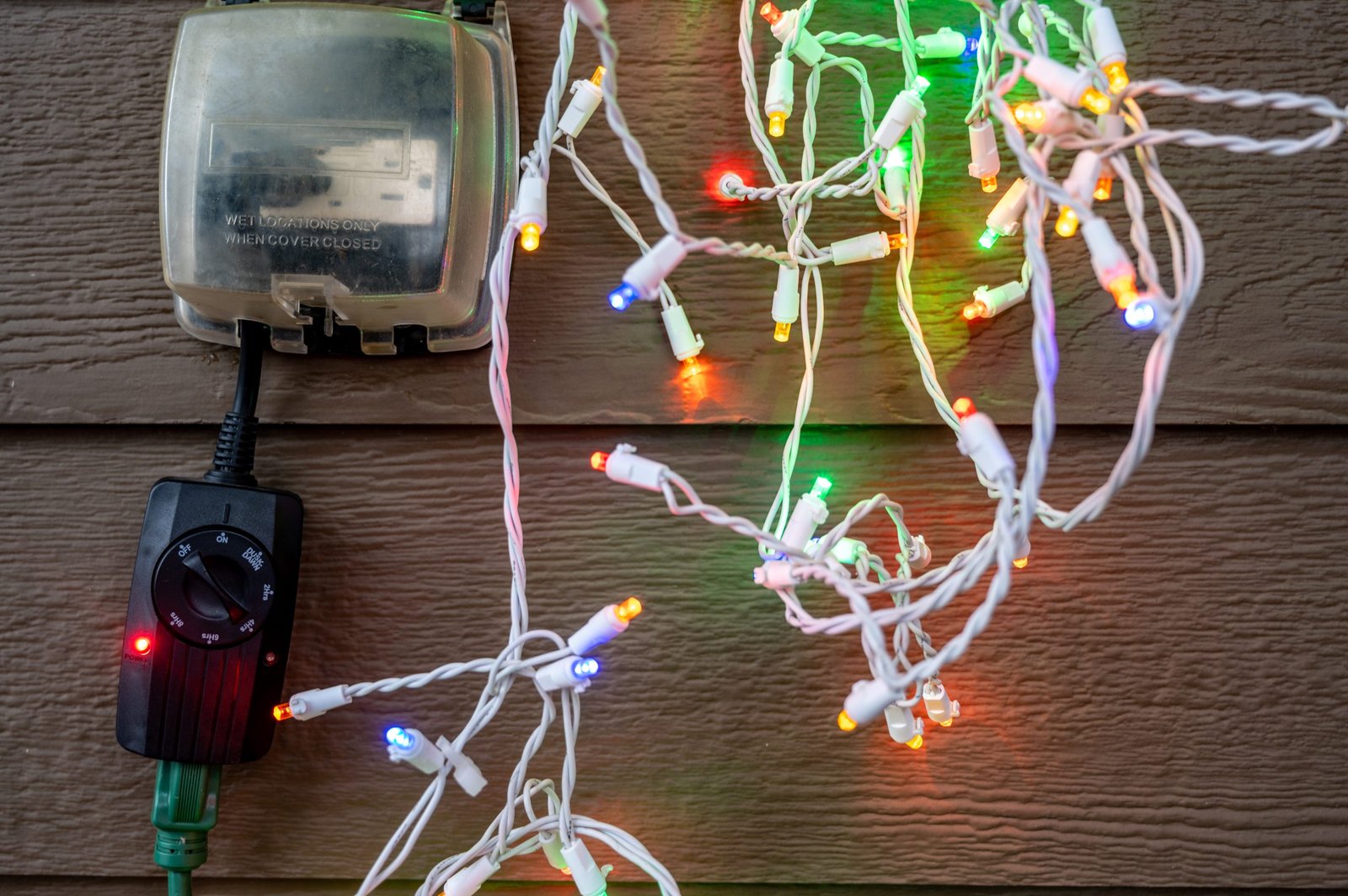 Outdoor,Timer,And,Gcfi,Outlet,With,Cover.,Blurred,Christmas,Lights Christmas-light-installation